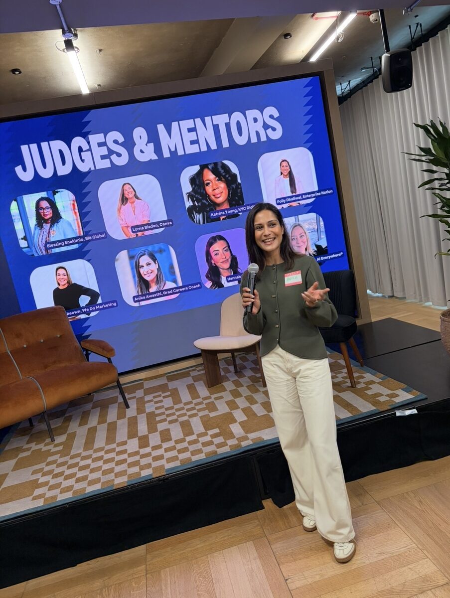 Anika Awasthi speaking on stage at an industry event